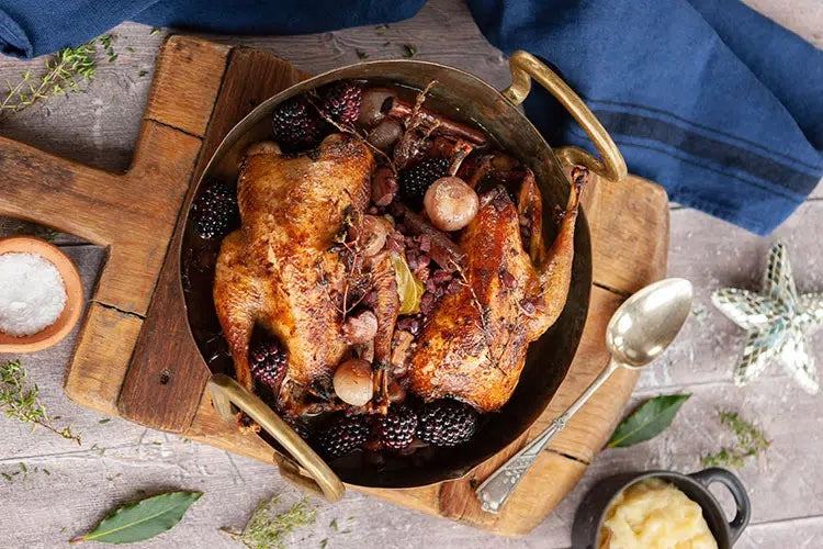 Pot roasted pheasant with mulled wine, shallots, bacon and blackberries